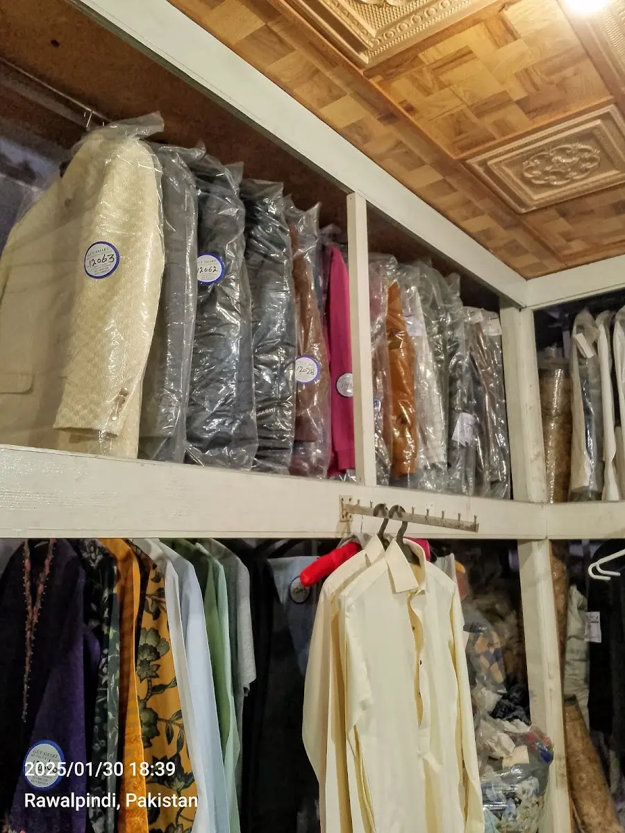 Finished orders hanging on the racks at Get Smart Laundry, F-10 Markaz